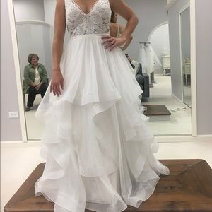 Unaltered, never before worn wedding dress